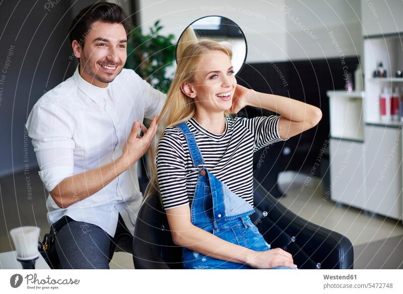 Happy woman at the hairdresser hair salon hair salons hair-dresser hair-dressers hairdressers haircutter haircutters females women happiness happy