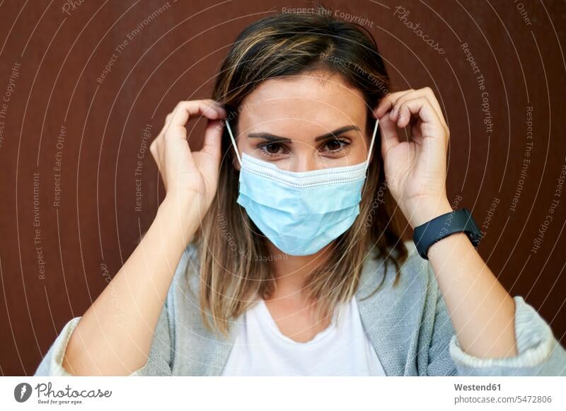Businesswoman wearing protective face mask businesswoman businesswomen business woman business women business people businesspeople Business Professional