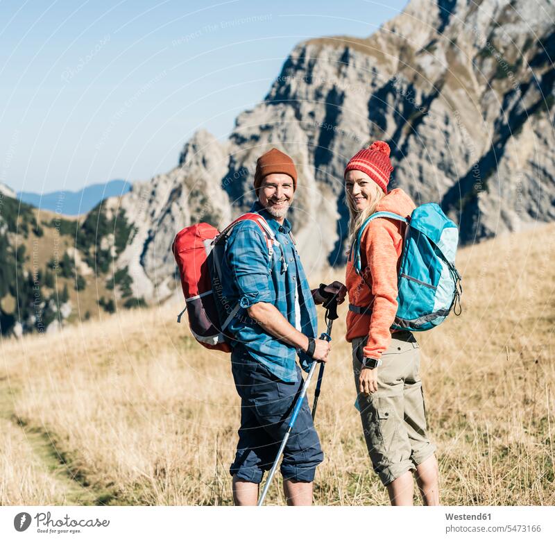 Austria, Tyrol, happy couple on a hiking trip in the mountains twosomes partnership couples mountain range mountain ranges hike happiness hiking tour