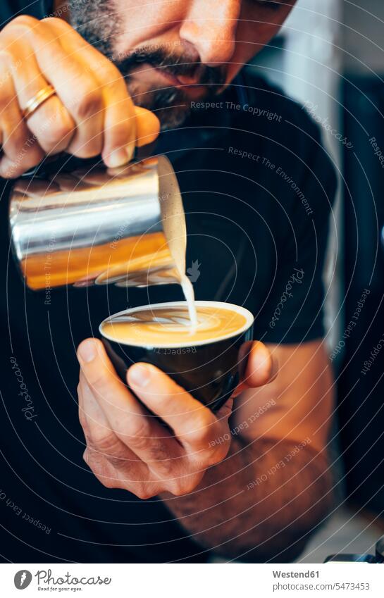 Barista preparing cappuccino in a coffee shop Baristas Cappuccino cappucino cafe White Coffee Milky Coffee Coffee with Milk Drink beverages Drinks Beverage