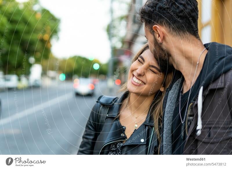 Portrait of happy young woman with her boyfriend delight enjoyment Pleasant pleasure Emotions Feeling Feelings Sentiment Sentiments loving closeness propinquity