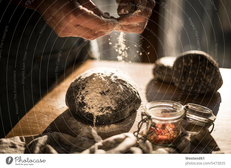 Man preparing black burger buns in kitchen domestic kitchen kitchens baking bake homemade home made home-made Hamburger roll Hamburger rolls Hamburger bun