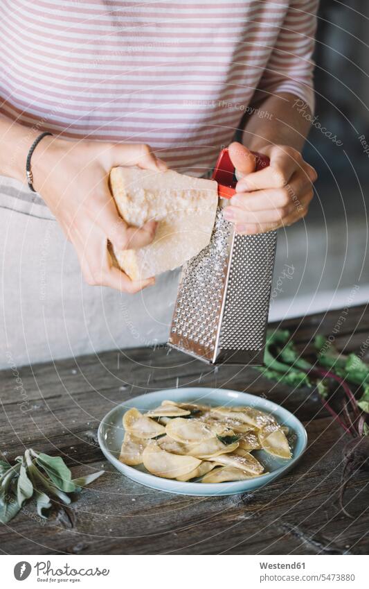 Filled ravioli on plate, cheese grater Tradition traditional Traditions woman females women homemade home made home-made preparation prepare preparing