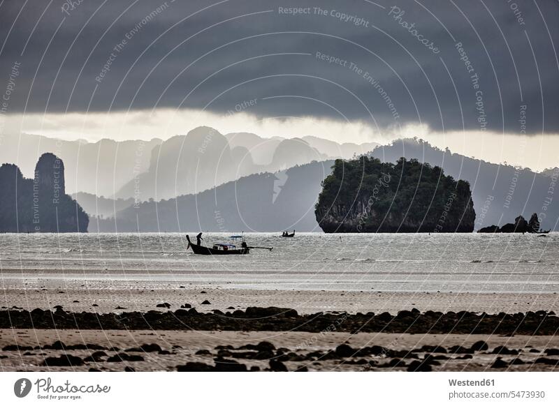 Thailand, Ko Yao Yai, silhouette of fishing boat on the sea coast coastline coast area Seacoast seaside fisherman cloudy cloudiness clouds nature natural world