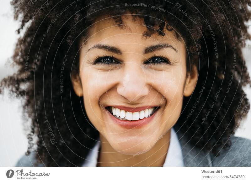 Portrait of happy woman with curly hair portrait portraits happiness curls curled females women people persons human being humans human beings Adults grown-ups