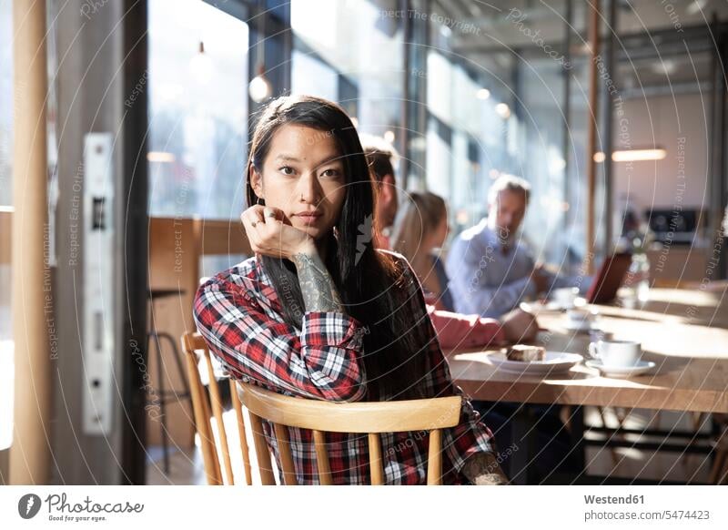 Portrait of woman with colleagues in a cafe Occupation Work job jobs profession professional occupation business life business world business person