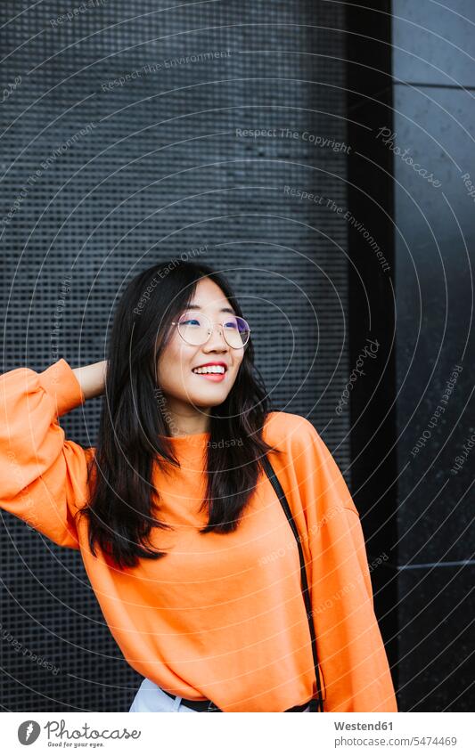 Portrait of smiling asian woman looking sideways jumper sweater Sweaters Eye Glasses Eyeglasses specs spectacles smile delight enjoyment Pleasant pleasure happy