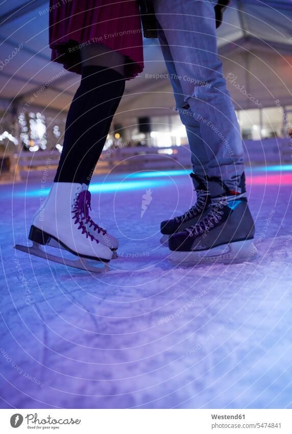 Premium Photo  Legs in figure skates are on the ice on the rink