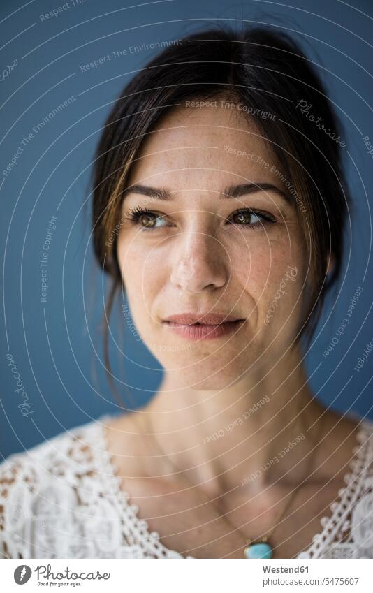 Portrait of a beautiful woman against blue background portrait portraits mature woman mature women confidence confident Beauty blue backgrounds females Adults