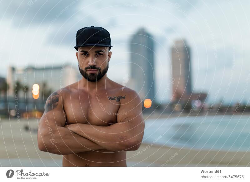 Portrait of barechested muscular man outdoors at dusk muscles athletic portrait portraits men males atmosphere atmospheric evening evening twilight people