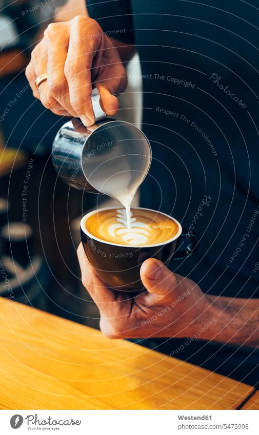 Close-up of barista preparing cappuccino in a coffee shop Barista Baristas Cappuccino cappucino cafe White Coffee Milky Coffee Coffee with Milk Drink beverages