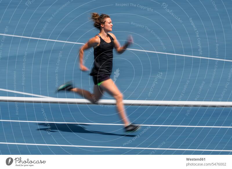 Female runner on tartan track full body full shot full-body full-length goals human human being human beings humans person persons caucasian appearance