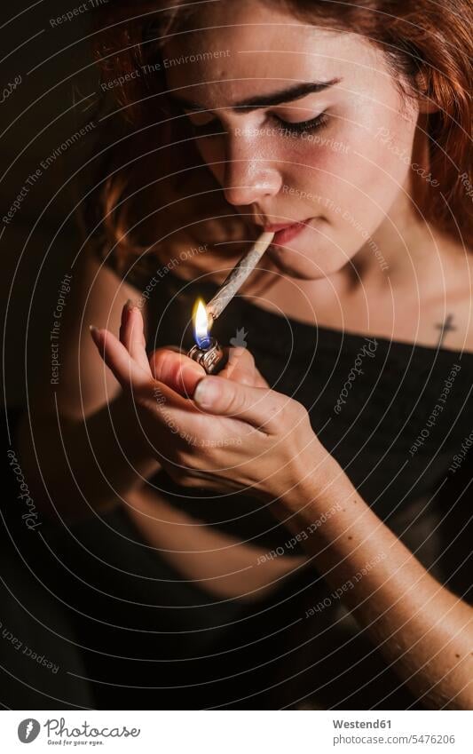Young woman smoking marihuana at home human human being human beings humans person persons caucasian appearance caucasian ethnicity european 1 one person only