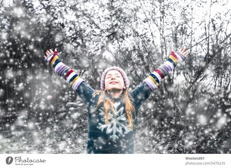 Happy girl at snowfall females girls happiness happy child children kid kids people persons human being humans human beings Joy enjoyment pleasure Pleasant