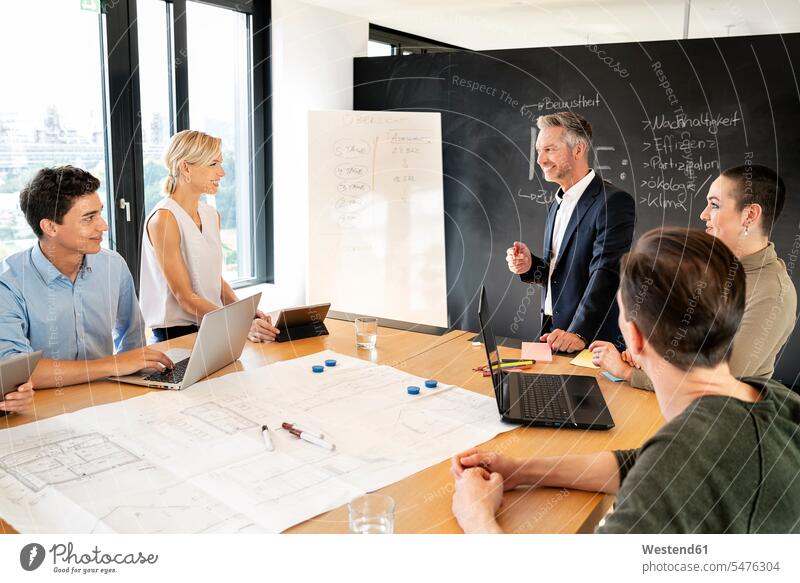 Business people having a workshop in office, discussing plans human human being human beings humans person persons caucasian appearance caucasian ethnicity