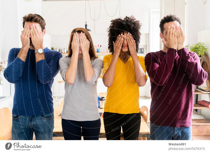 Four friends standing side by side at home covering their faces mate jumper sweater Sweaters embarrassed Embarrassment ashamed Shame shameful Ideas encounter