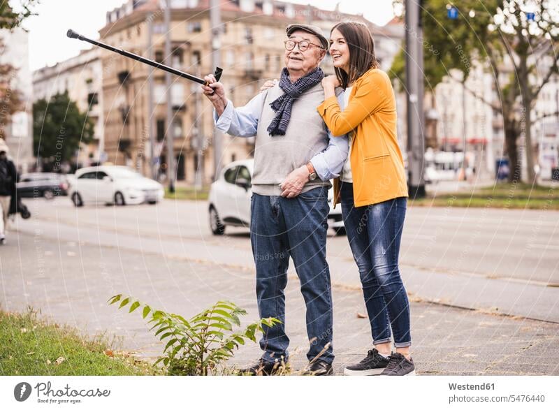 Senior man and adult granddaughter exploring the city human human being human beings humans person persons caucasian appearance caucasian ethnicity european 2