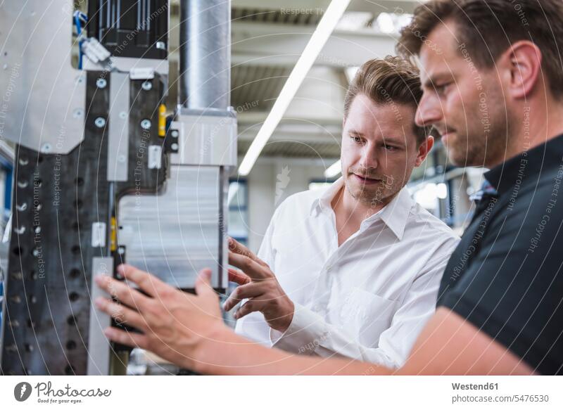 Two men having a meeting in factory colleague Occupation Work job jobs profession professional occupation business life business world business person