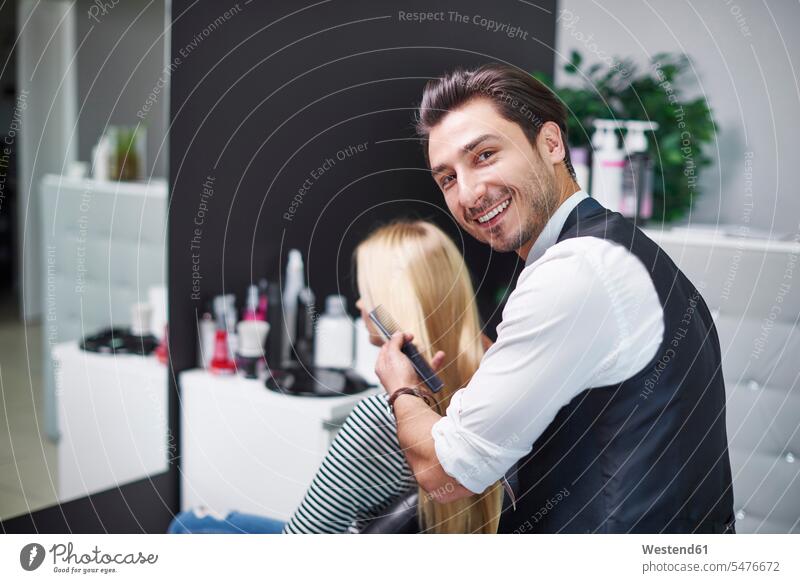 Portrait of smiling hairdresser at work smile portrait portraits working At Work hair-dresser hair-dressers hairdressers haircutter haircutters hair salon