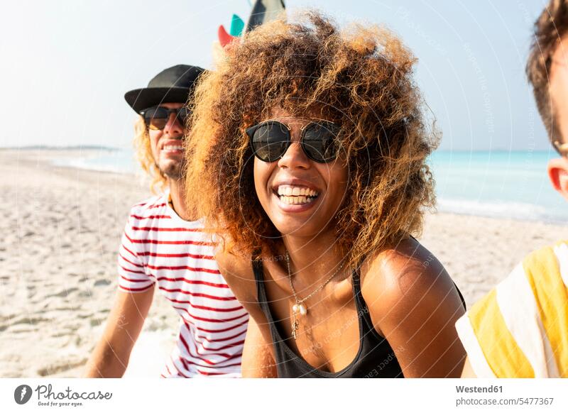 Group of friends having fun on the beach beaches together Fun funny sea ocean water waters body of water friendship laughing Laughter Activity active positive