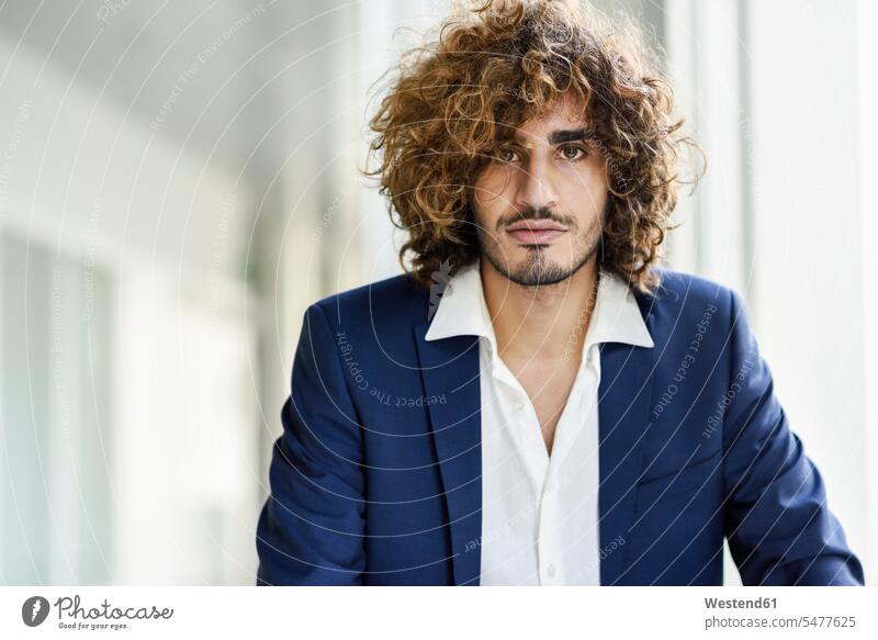 Portrait of young businessman with beard and curly hair portrait portraits curls hairstyle hair-dos hairstyles hairdos people persons human being humans