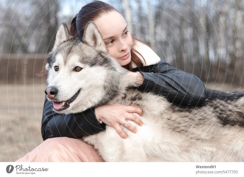 Portrait of happy woman cuddling her husky human human being human beings humans person persons caucasian appearance caucasian ethnicity european 1