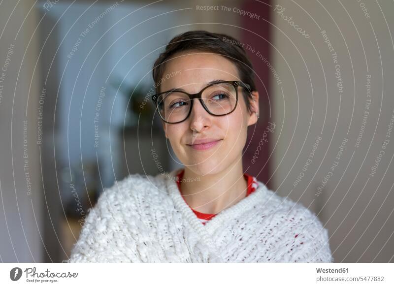 Portrait of a smiling young woman with short hair, wearing glasses dark hair dark-haired specs Eye Glasses spectacles Eyeglasses smile portrait portraits pretty
