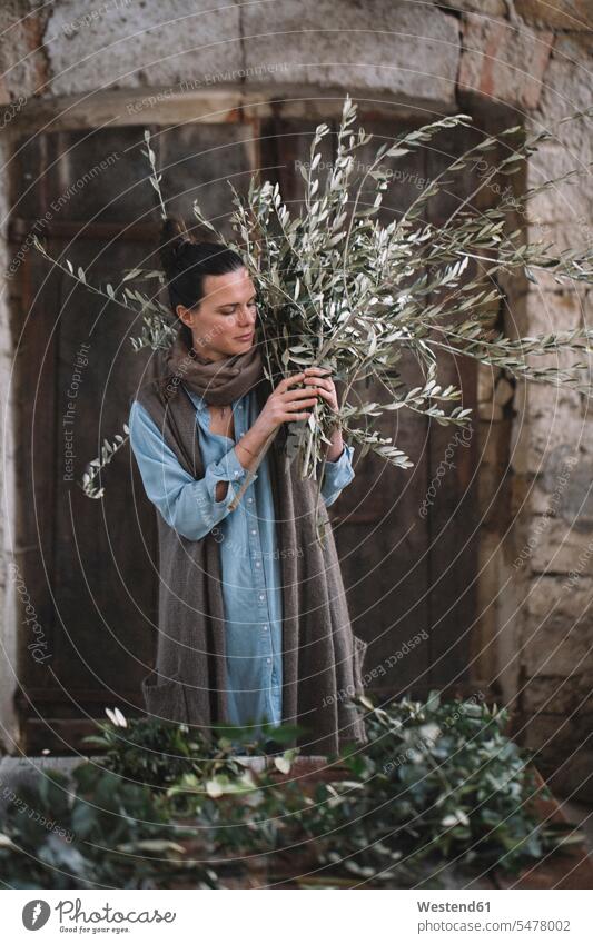 Woman arranging twigs Floristics Floristry decoration Twig Twigs sprig sprigs florist female florist woman females women craft crafts handwork handcraft