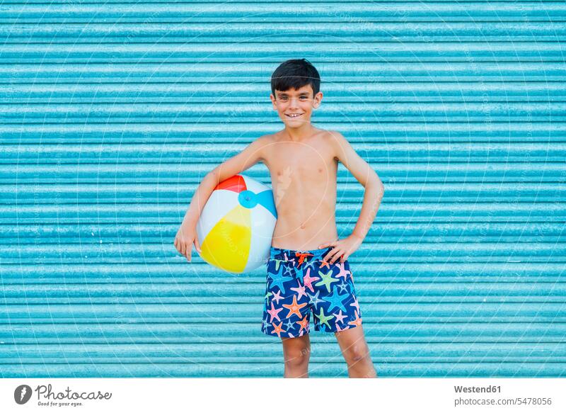 Portrait of smiling boy with beach ball Sea Star SeaStar star fish starfishes hold seasons summer time summertime summery relax relaxing relaxation delight