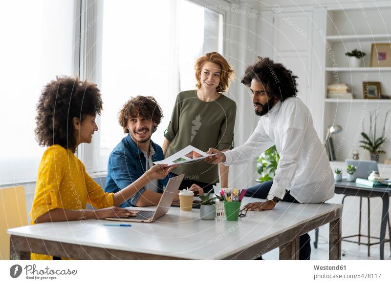 Young entrepreneurs having a meeting in their office Cooperation working together collaboration Cooperating Cooperate Co-Operation Collaborating collaborate