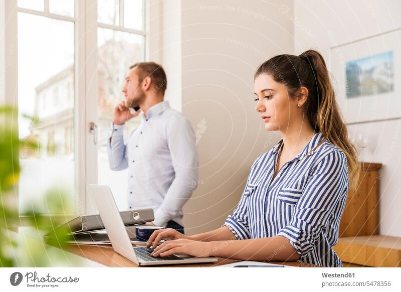 Young woman working on her laptop at home At Work females women Laptop Computers laptops notebook Adults grown-ups grownups adult people persons human being