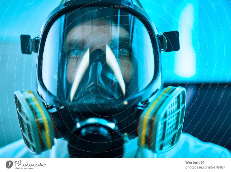 Portrait of man wearing respirator men males portrait portraits espirator mask filter mask Adults grown-ups grownups adult people persons human being humans