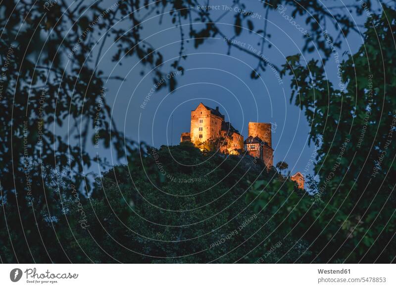 Germany, North Rhine-Westphalia, Oberwesel, Schonburg castle standing on top of hill in Rhine Gorge at night outdoors location shots outdoor shot outdoor shots