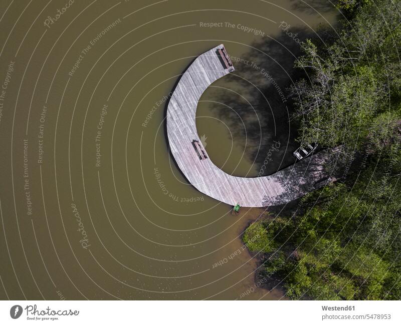 Russia, Moscow Oblast, Aerial view of curved jetty on shore of Lake Dolgoe outdoors location shots outdoor shot outdoor shots day daylight shot daylight shots