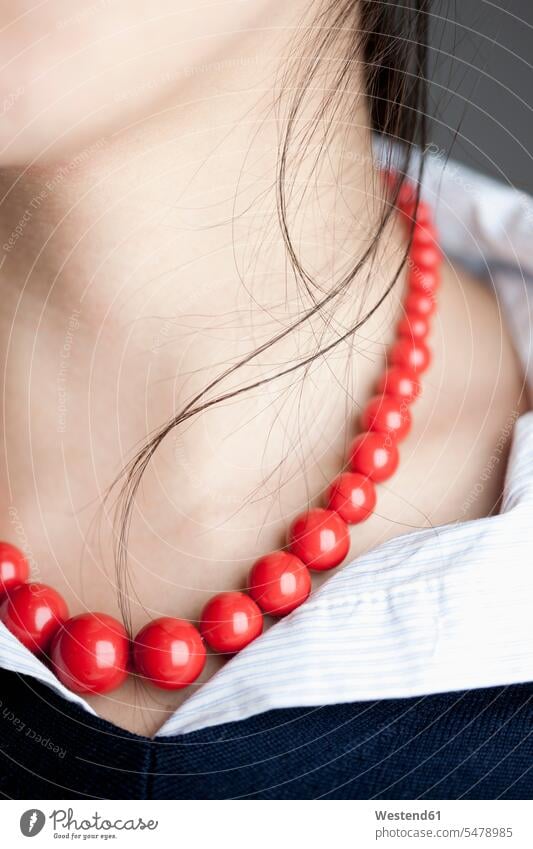 Japanese woman with red necklace, close up female Japanese Japanese Ethnicity color image colour image Part Of partial view midsection mid section luxury