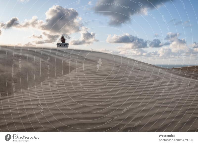 Denmark, Lonstrup, Rippled sand dune with Rubjerg Knude Lighthouse in background outdoors location shots outdoor shot outdoor shots rural scene Non Urban Scene