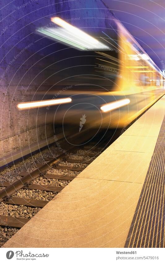 Germany, Munich, Subway train moving speedly railway railroad platform station color image colour image move blurred motion streaming motion blur