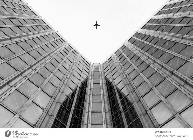 Germany, Duesseldorf, view to plane and facades of high-rise buildings from below clear sky copy space cloudless height altitude skies Upward View