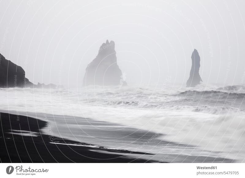 Iceland, South Iceland, Vik i Myrdal, Vik Rock on Reynisfjara beach colour colours skies clouds copy space horizons landscapes scenery terrain coast area