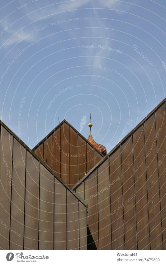 Germany, Baden-Wurttemberg, Sigmaringen, Church belfry peeking over wooden houses outdoors location shots outdoor shot outdoor shots day daylight shot