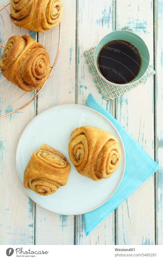 Home-baked Franzbroetchen and cup of coffee Pastry Pastries Napkin Serviette Serviettes Napkins overhead view from above top view Overhead Overhead Shot