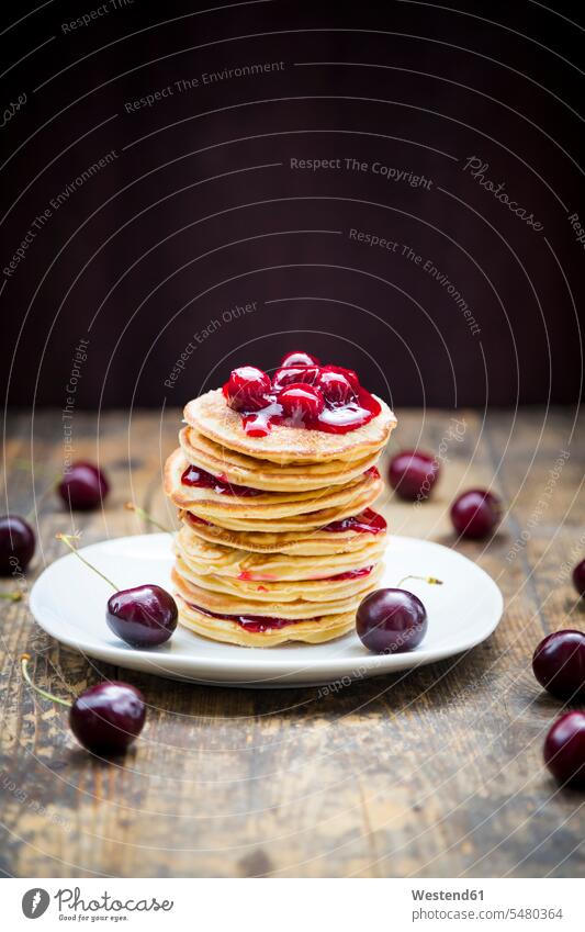 Stack of American pancakes with cherries and cherry groats food and drink Nutrition Alimentation Food and Drinks wooden American cuisine stack stacked stacks