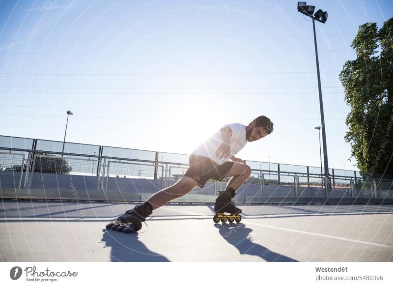 Man with rollerblades skidding inline skating Rollerblades man men males leisure free time leisure time inline-skater inline-skaters Skidding inline skates