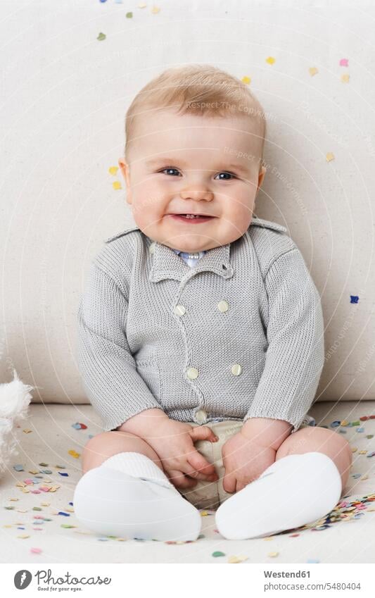 Portrait of happy baby boy portrait portraits baby boys male infants nurselings babies people persons human being humans human beings sitting Seated giggling