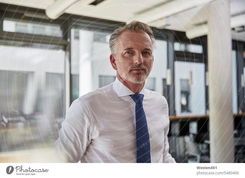 Portrait of a successful businessman wearing shirt and tie Business Trip executive travel Business Trips Business Travel Business Travels airport terminal