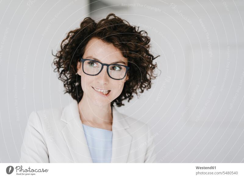 Businesswoman wearing glasses, looking doubtfully thinking curly hair curls insecurity insecure uncertain Unsure specs Eye Glasses spectacles Eyeglasses