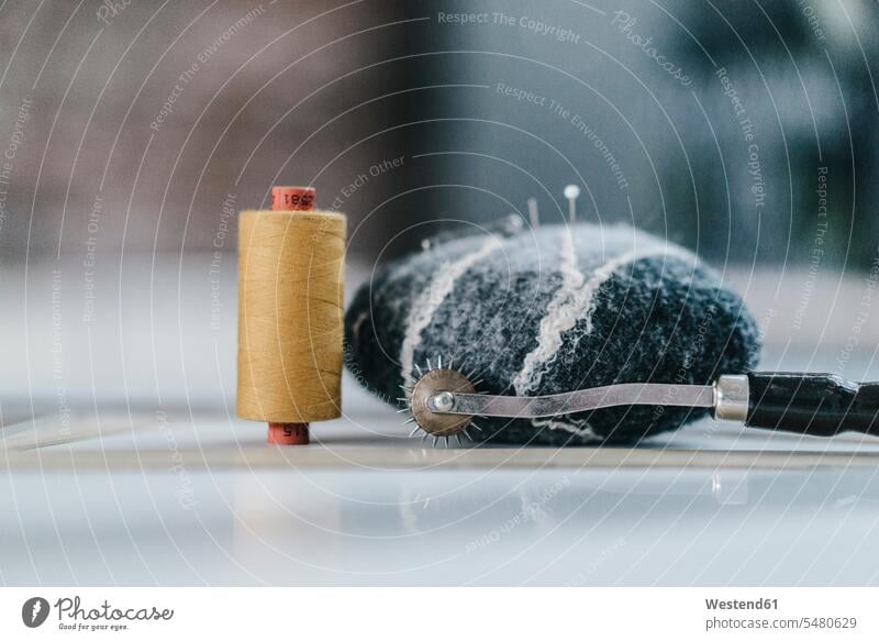 Pin cushion and cotton reel - a Royalty Free Stock Photo from Photocase
