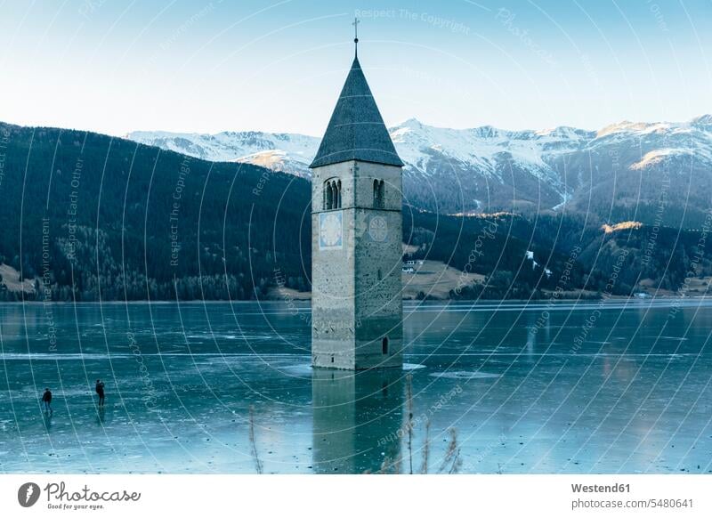 Italy, Venosta Valley, Sunken spire in frozen Lago di Resia cold Cold Weather Cold Temperature chilly Reschensee Vinschgau lake lakes day daylight shot