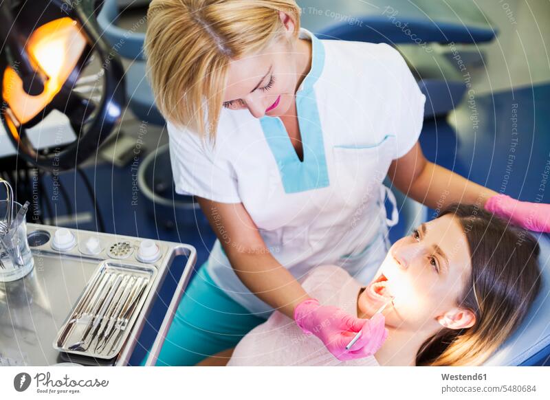 Dentist examining patient's teeth Checkup female dentist female dentists female dental surgeons Female Doctor physicians Female Doctors Orthodontist treatment