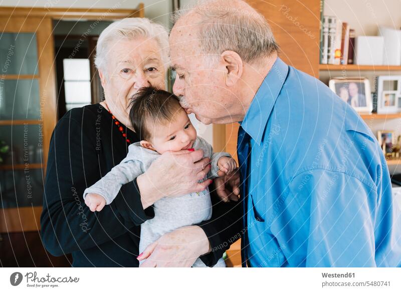 Great-grandparents with baby at home great-grandparents babies infants grandchild grandchildren family families people persons human being humans human beings